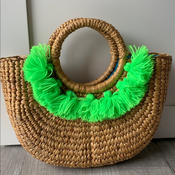Handbags - NWOT Jade tribe Round Woven Straw Handbag with Neon Green Fringe.